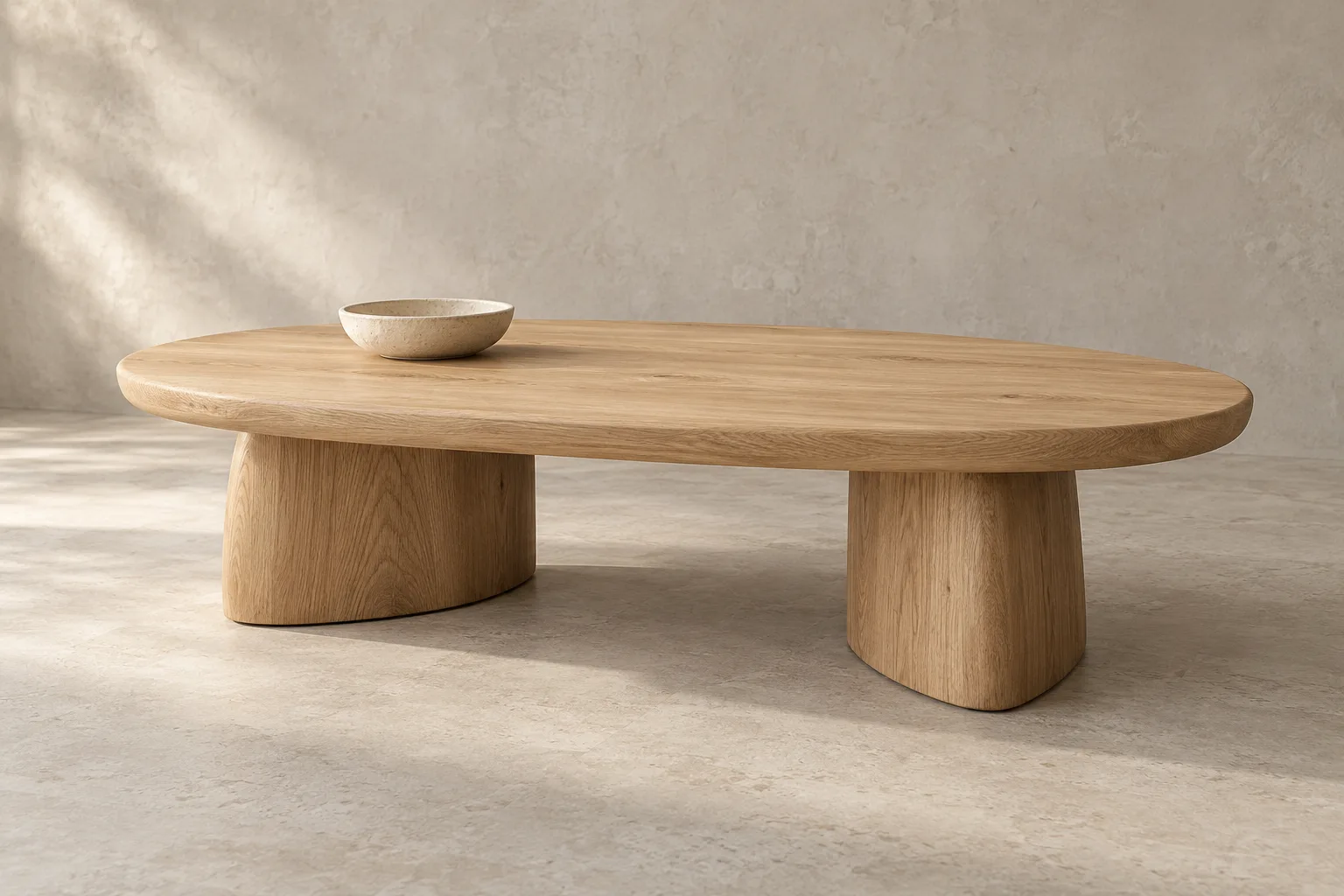 Low oval oak coffee table with sculptural timber legs